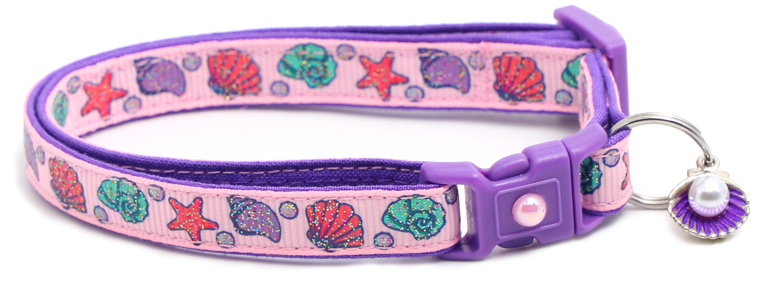 Beachcomber Breakaway Cat Collar in vibrant colors, featuring a breakaway clip and removable bell, made from soft reinforced cotton.